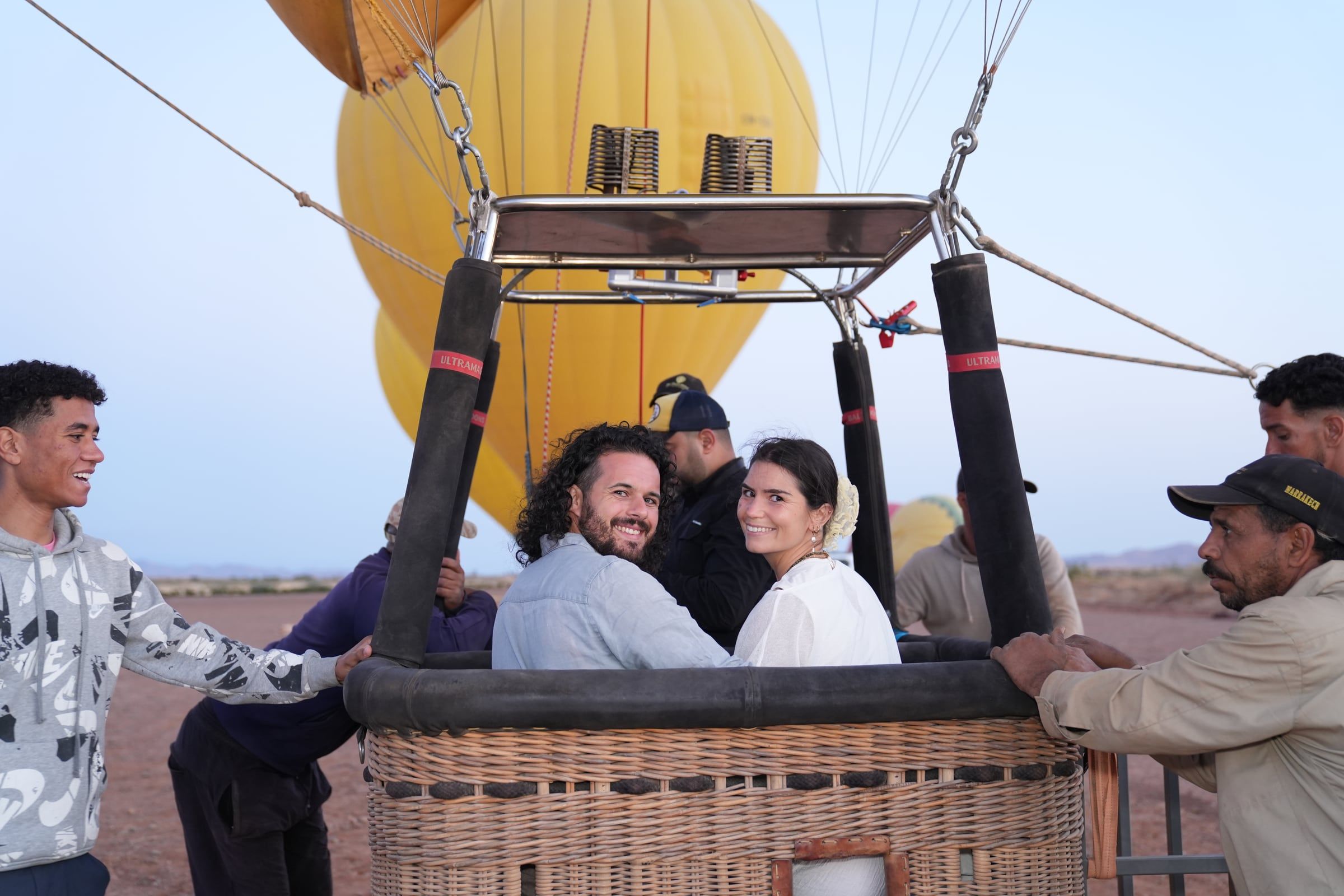 Hot-air balloon launch at dawn near Marrakech with the couple in the basket