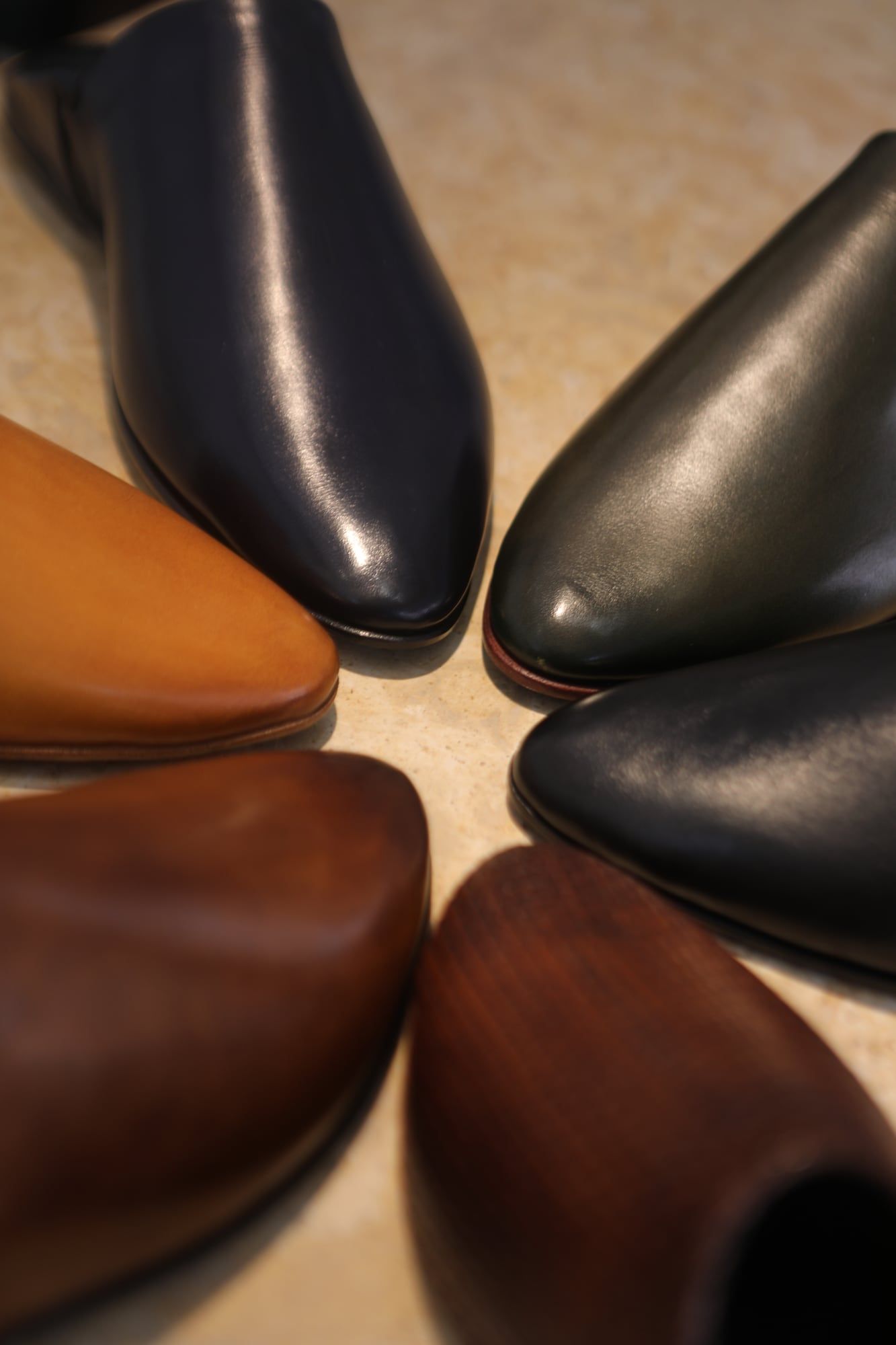 Leather shoes arranged in a circle for product photography