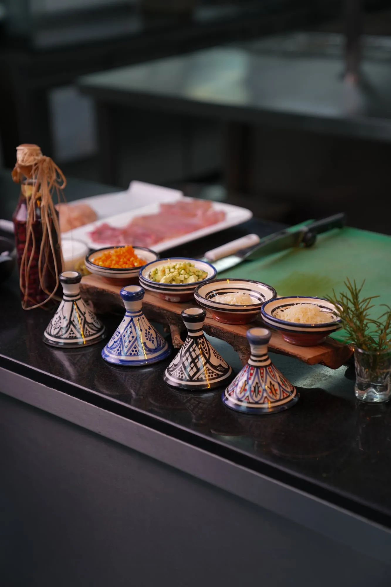 Moroccan spices served in small tagine pots on a buffet