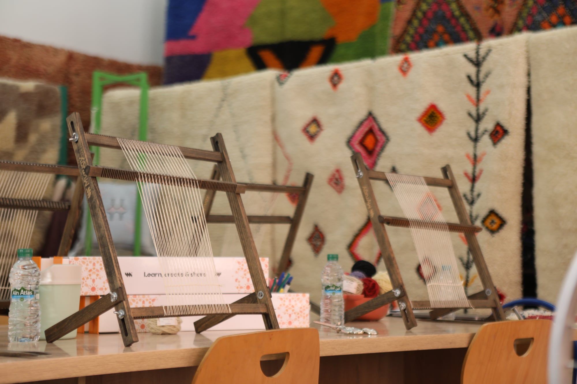 Rug-weaving workshop with looms and Berber rugs photographed for a craft brand